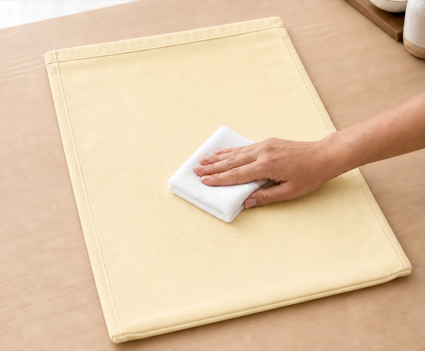 Original Amazon A+ care photograph showing the pale beeswax-based lining being gently wiped.